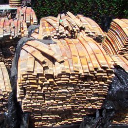 piles of wood to be made into bbq smoking chips and pellets